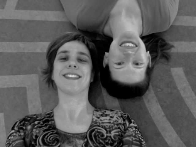 karen and Anne Howarth lay in a labyrinth with their heads facing up